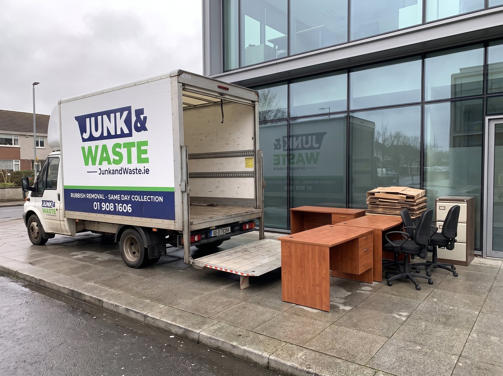 Desks and office chairs outside a glass office unit in Sandyford